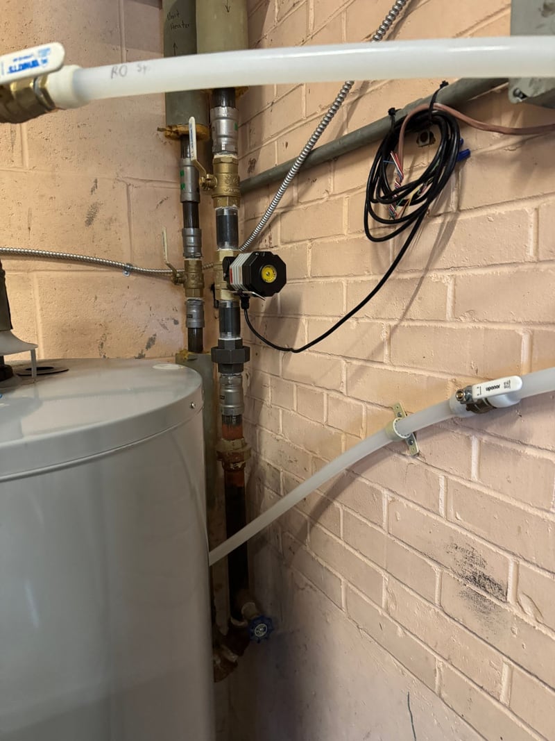 Automatic water shutoff valve beside a water heater