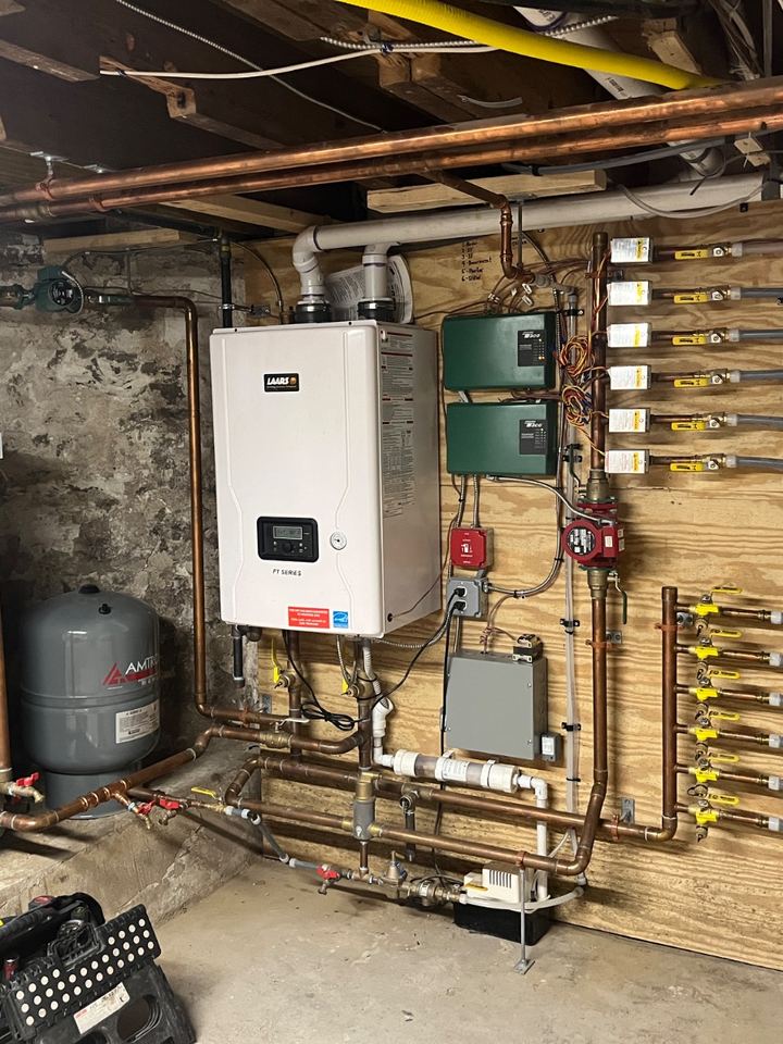 High-efficiency Laars FT Series boiler with copper manifold and Taco zone controls