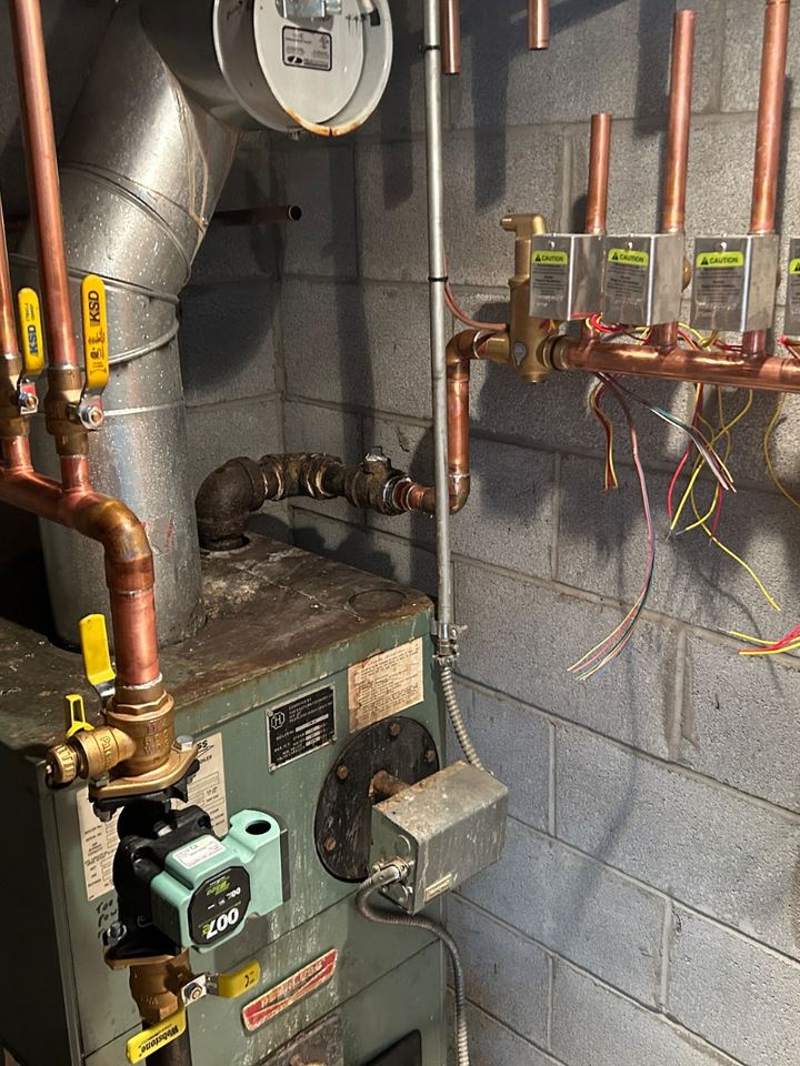 Copper manifold and zone valves on a residential heating system
